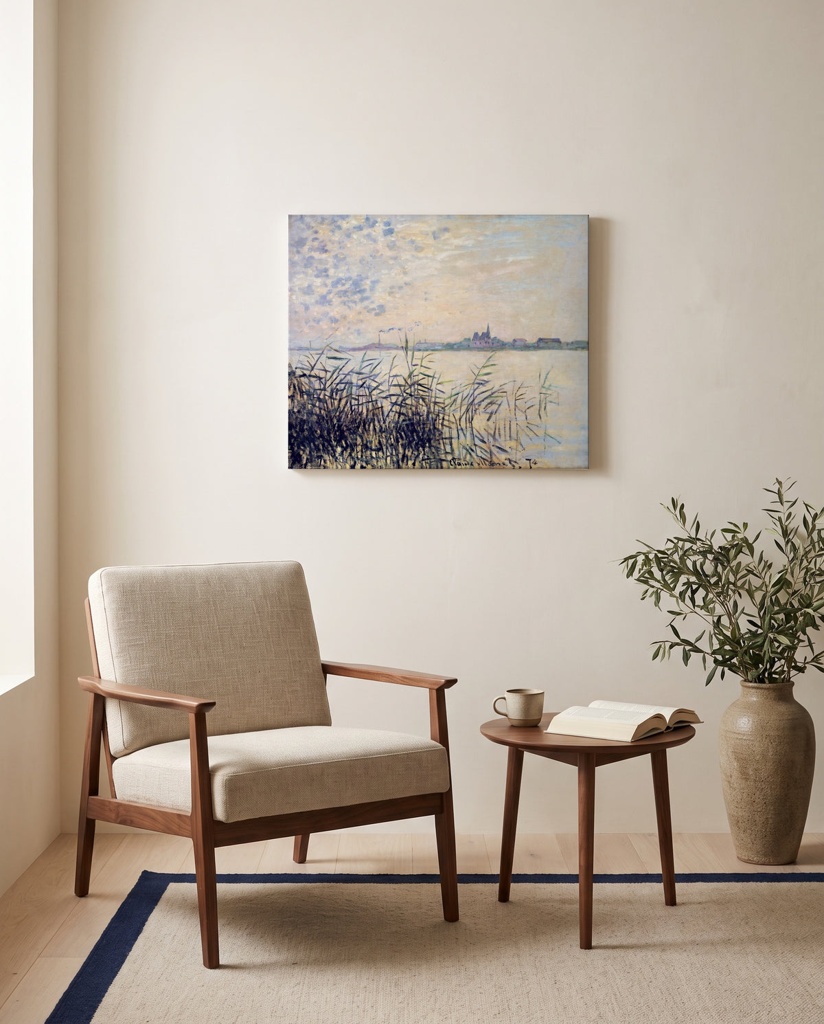 The Seine near Argenteuil by Claude Monet as a stretched canvas above a linen lounge chair in a reading corner