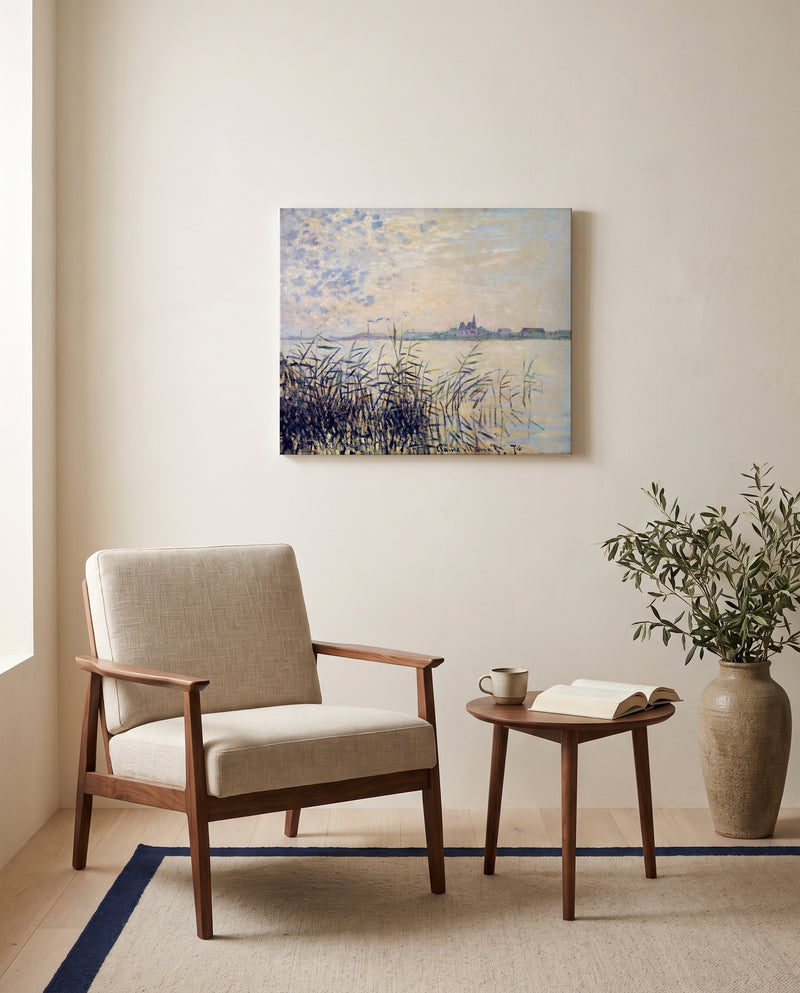 The Seine near Argenteuil by Claude Monet as a stretched canvas above a linen lounge chair in a reading corner
