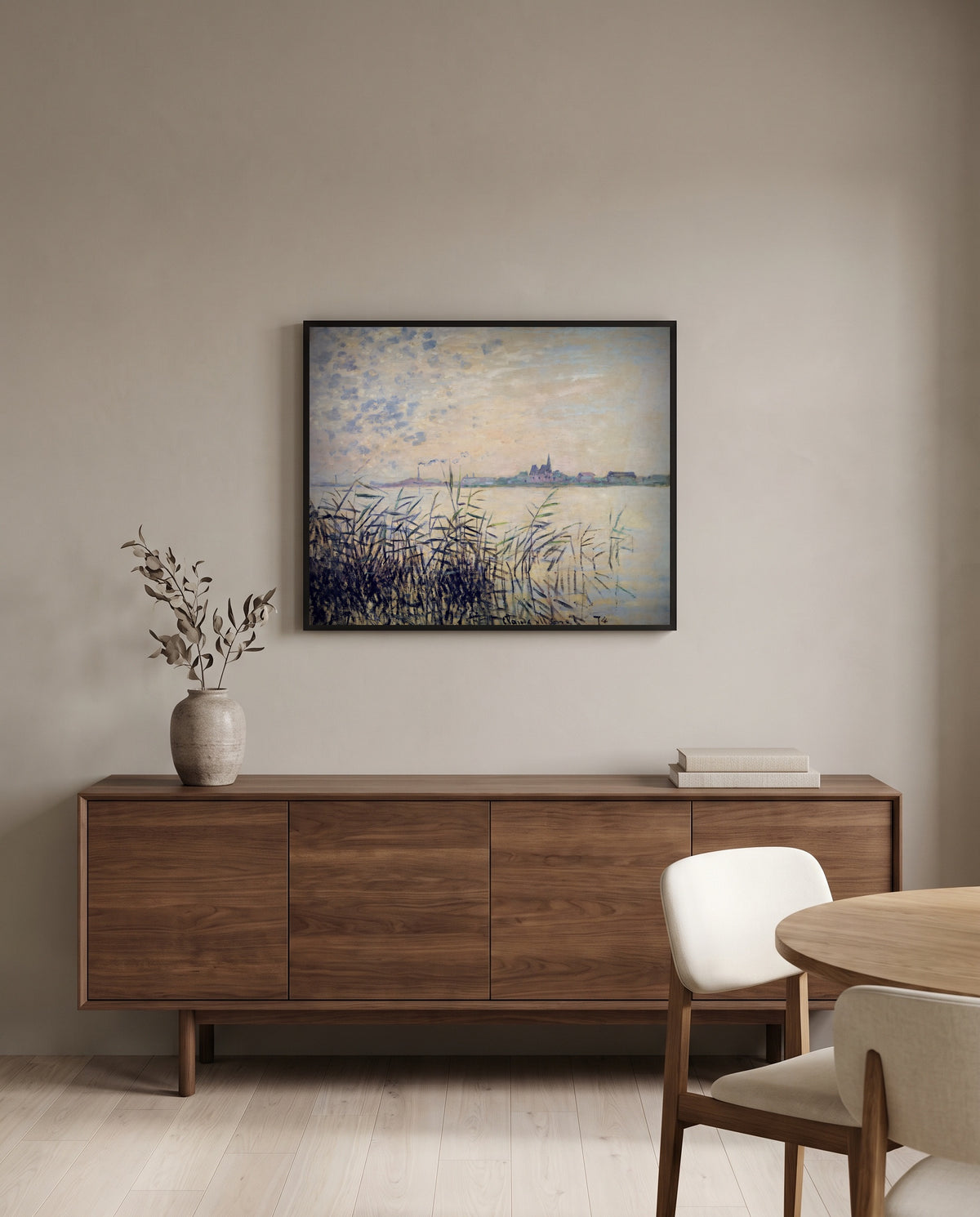 The Seine near Argenteuil by Claude Monet in a black frame above a walnut sideboard in a dining room