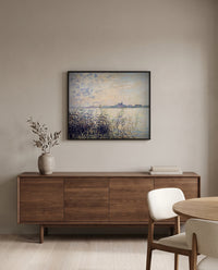 The Seine near Argenteuil by Claude Monet in a black frame above a walnut sideboard in a dining room