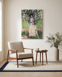 The Stroller by Claude Monet as a stretched canvas above a linen lounge chair in a reading corner