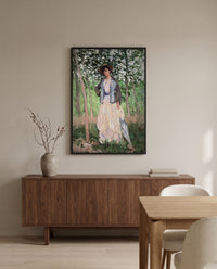 The Stroller by Claude Monet in a black frame above a walnut sideboard in a dining room