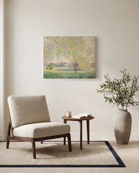 The Willows by Claude Monet as a stretched canvas above a linen lounge chair in a reading corner