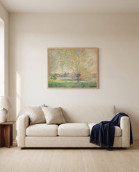 The Willows by Claude Monet framed in natural oak above a cream sofa in a warm living room
