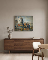 Windmill, Amsterdam by Claude Monet in a black frame above a walnut sideboard in a dining room