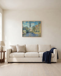 The Zuiderkerk, Amsterdam by Claude Monet framed in natural oak above a cream sofa in a warm living room