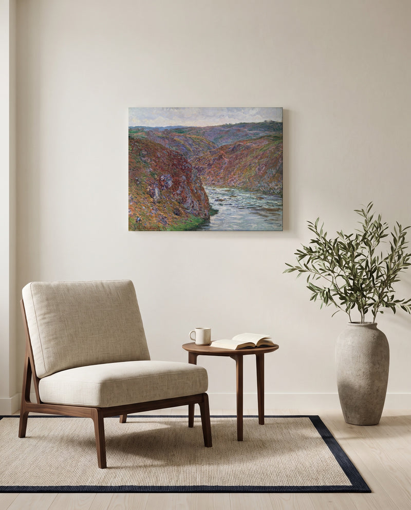 Valley of the Creuse by Claude Monet as a stretched canvas above a linen lounge chair in a reading corner