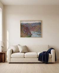 Valley of the Creuse by Claude Monet framed in natural oak above a cream sofa in a warm living room