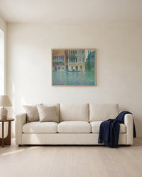 Palazzo Dario by Claude Monet framed in natural oak above a cream sofa in a warm living room