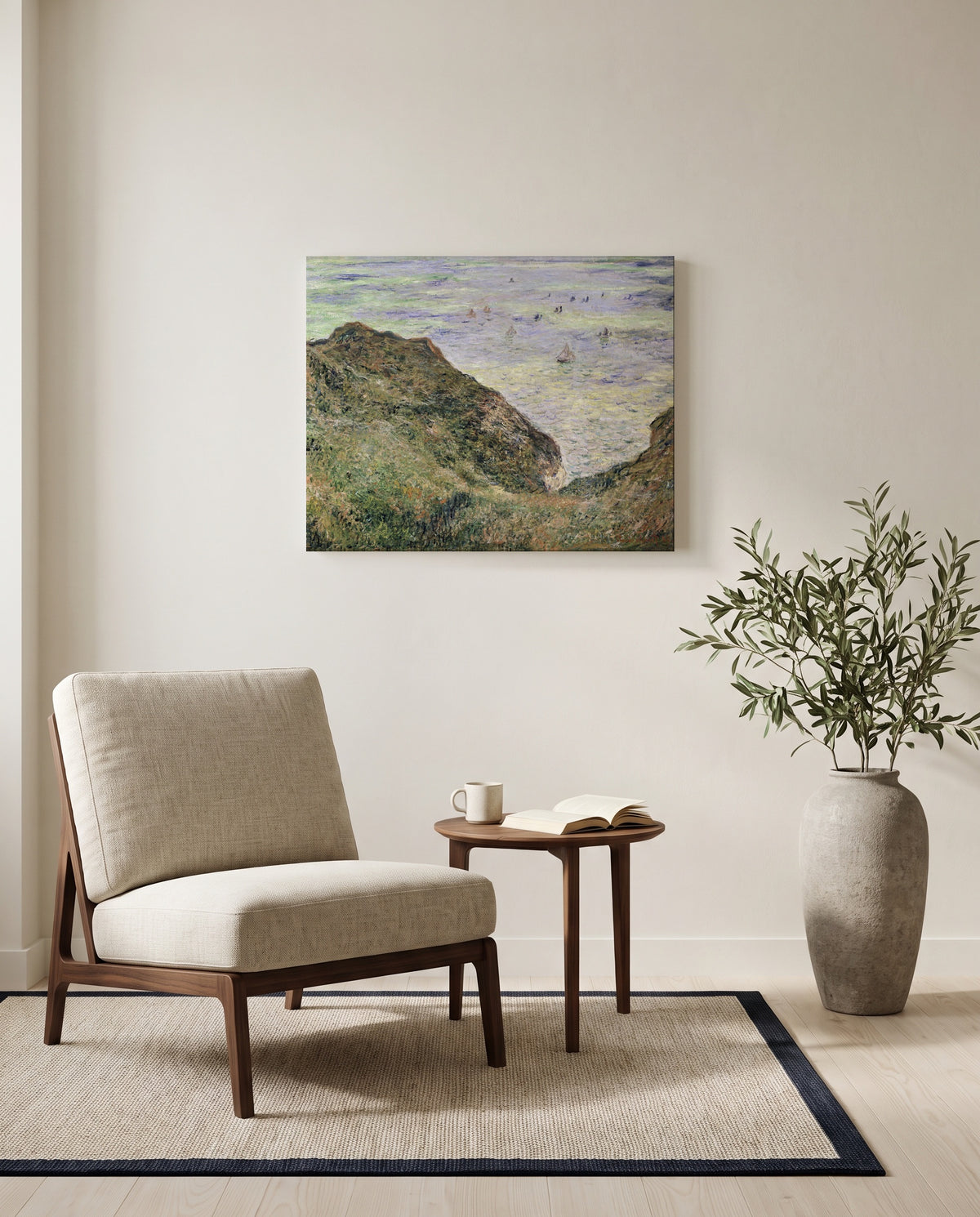 View over the Sea by Claude Monet as a stretched canvas above a linen lounge chair in a reading corner