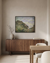 View over the Sea by Claude Monet in a black frame above a walnut sideboard in a dining room