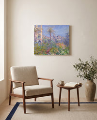 Villas at Bordighera by Claude Monet as a stretched canvas above a linen lounge chair in a reading corner