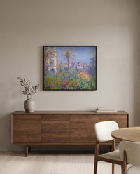 Villas at Bordighera by Claude Monet in a black frame above a walnut sideboard in a dining room