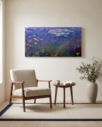 Water Lilies (Agapanthus) by Claude Monet as a stretched canvas above a linen lounge chair in a reading corner