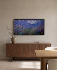 Water Lilies (Agapanthus) by Claude Monet in a black frame above a walnut sideboard in a dining room