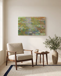 Water Lily Pond, 1917–19 by Claude Monet as a stretched canvas above a linen lounge chair in a reading corner