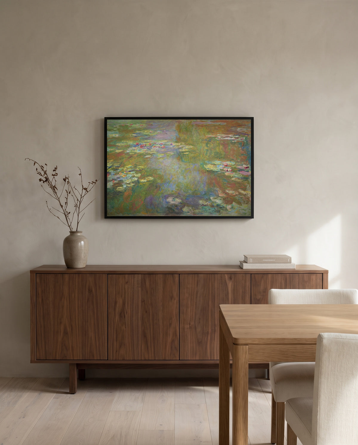 Water Lily Pond, 1917–19 by Claude Monet in a black frame above a walnut sideboard in a dining room