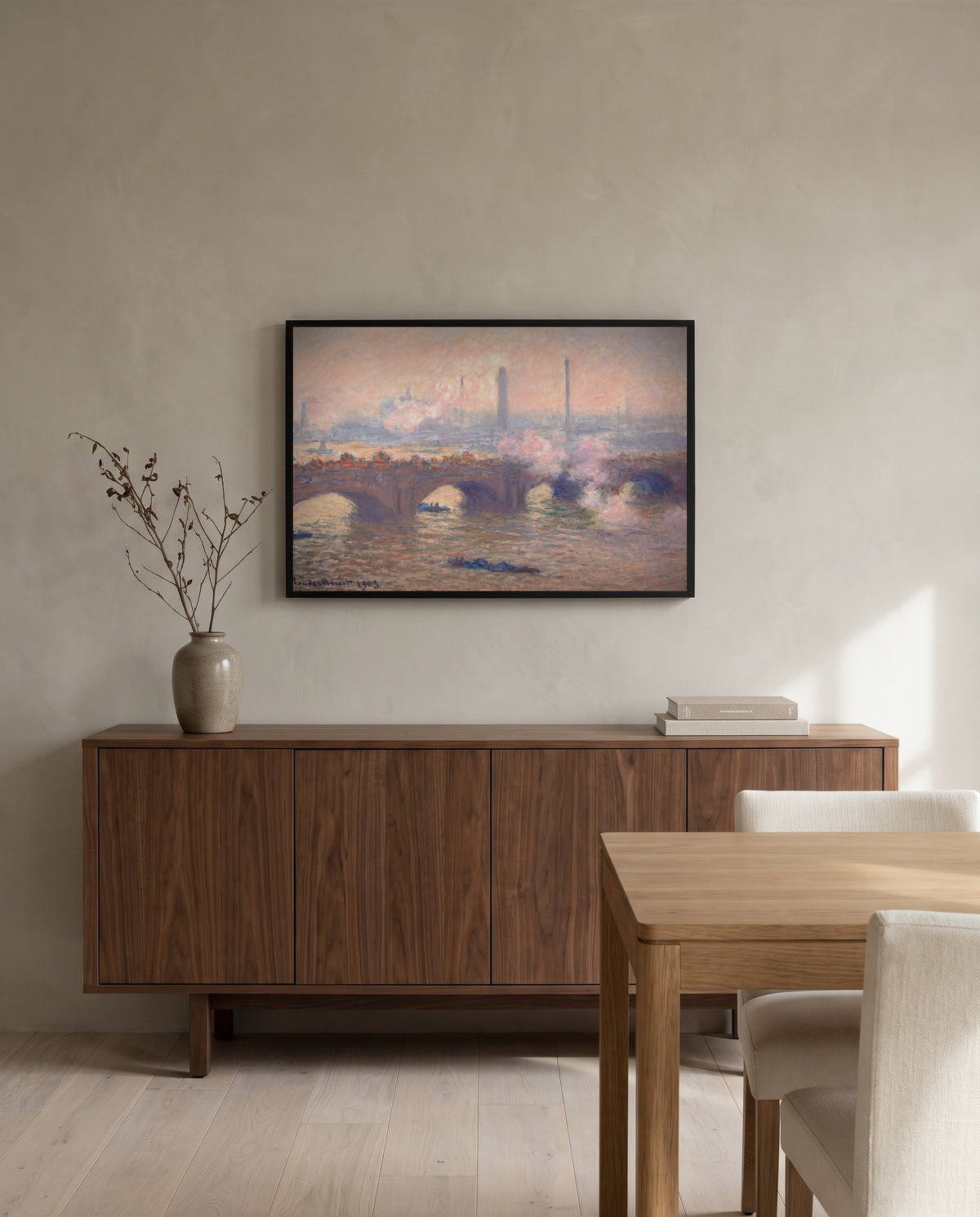 Waterloo Bridge, Gray Day by Claude Monet in a black frame above a walnut sideboard in a dining room