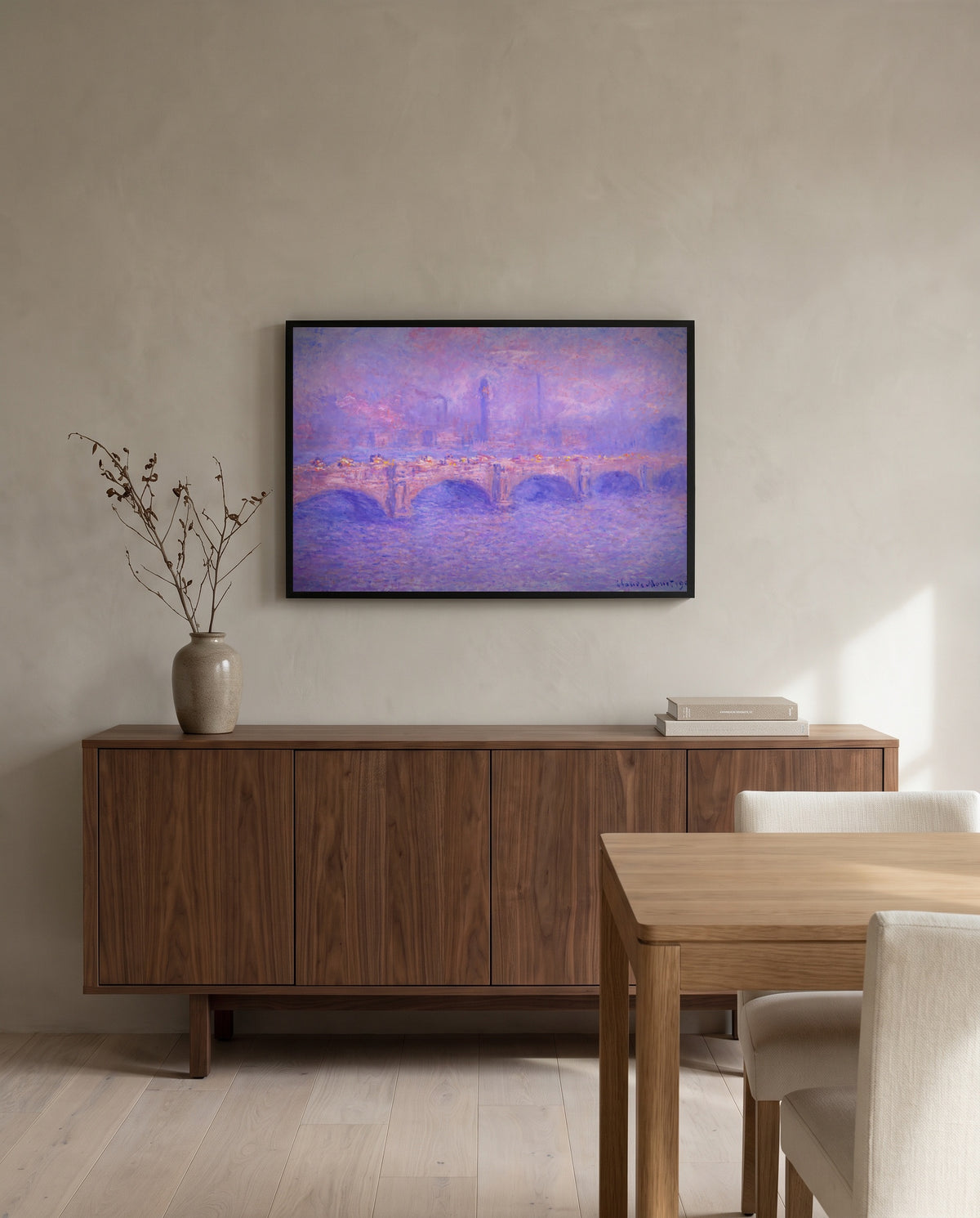 Waterloo Bridge, Sunlight by Claude Monet in a black frame above a walnut sideboard in a dining room