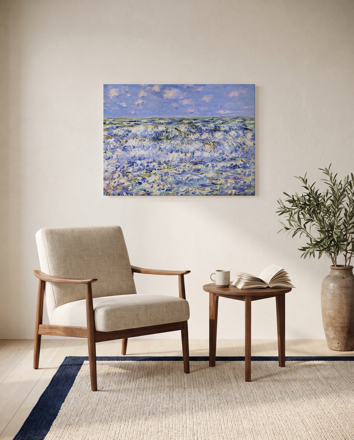 Waves Breaking by Claude Monet as a stretched canvas above a linen lounge chair in a reading corner