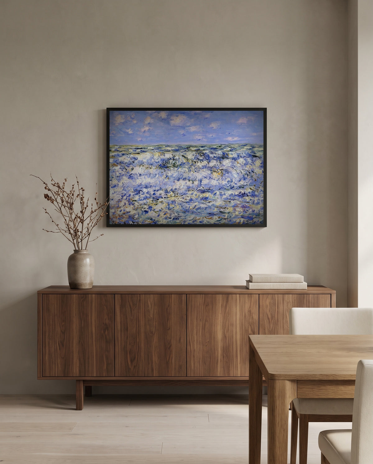 Waves Breaking by Claude Monet in a black frame above a walnut sideboard in a dining room