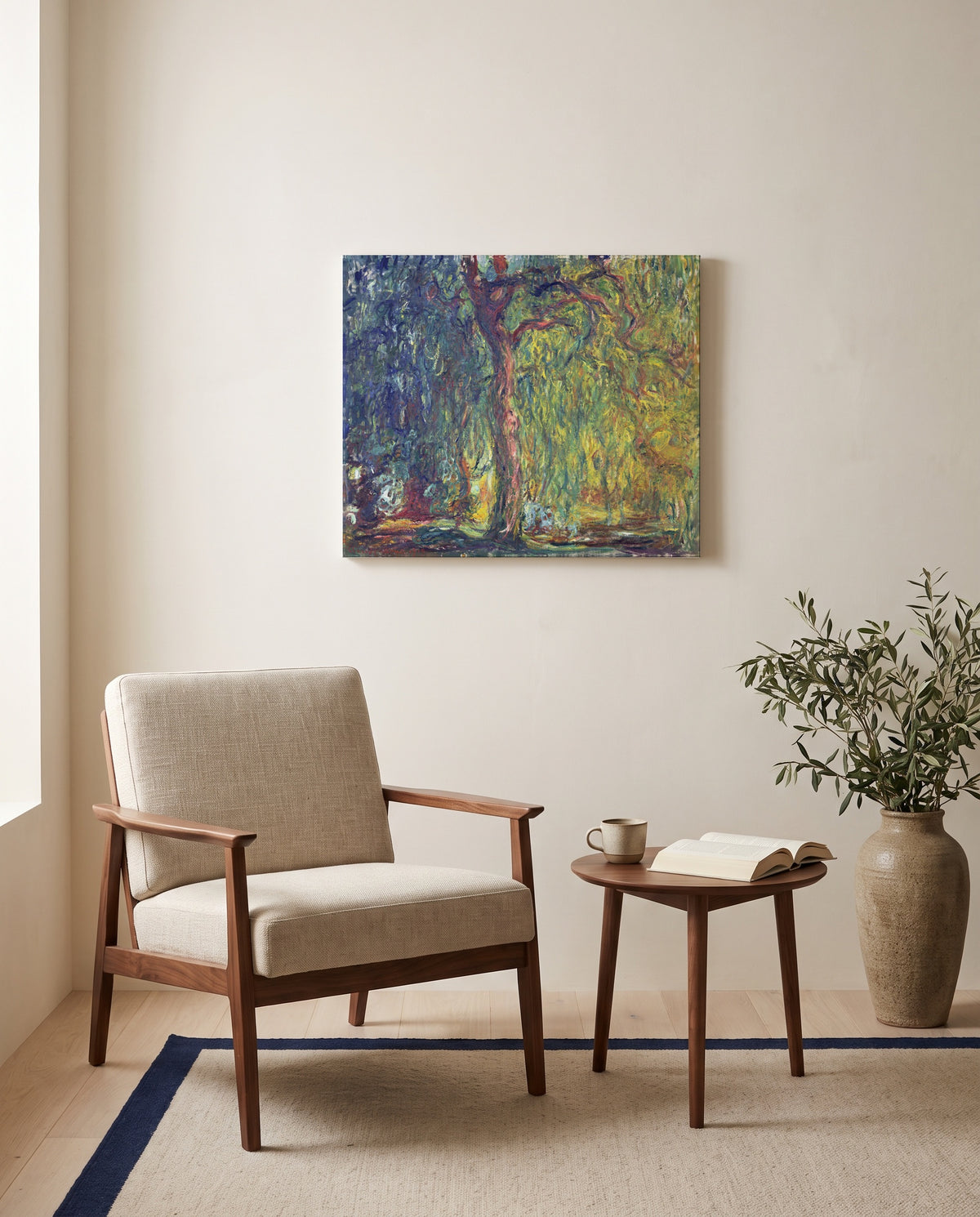 Weeping Willow by Claude Monet as a stretched canvas above a linen lounge chair in a reading corner