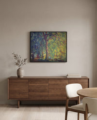 Weeping Willow by Claude Monet in a black frame above a walnut sideboard in a dining room
