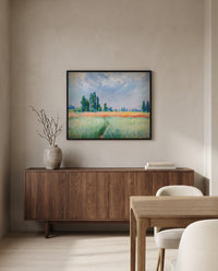 Wheatfield by Claude Monet in a black frame above a walnut sideboard in a dining room