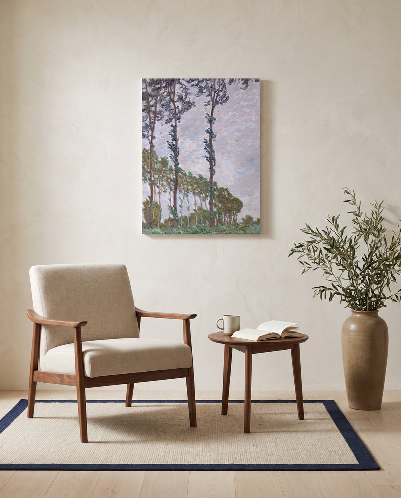 Wind Effect, Poplars by Claude Monet as a stretched canvas above a linen lounge chair in a reading corner
