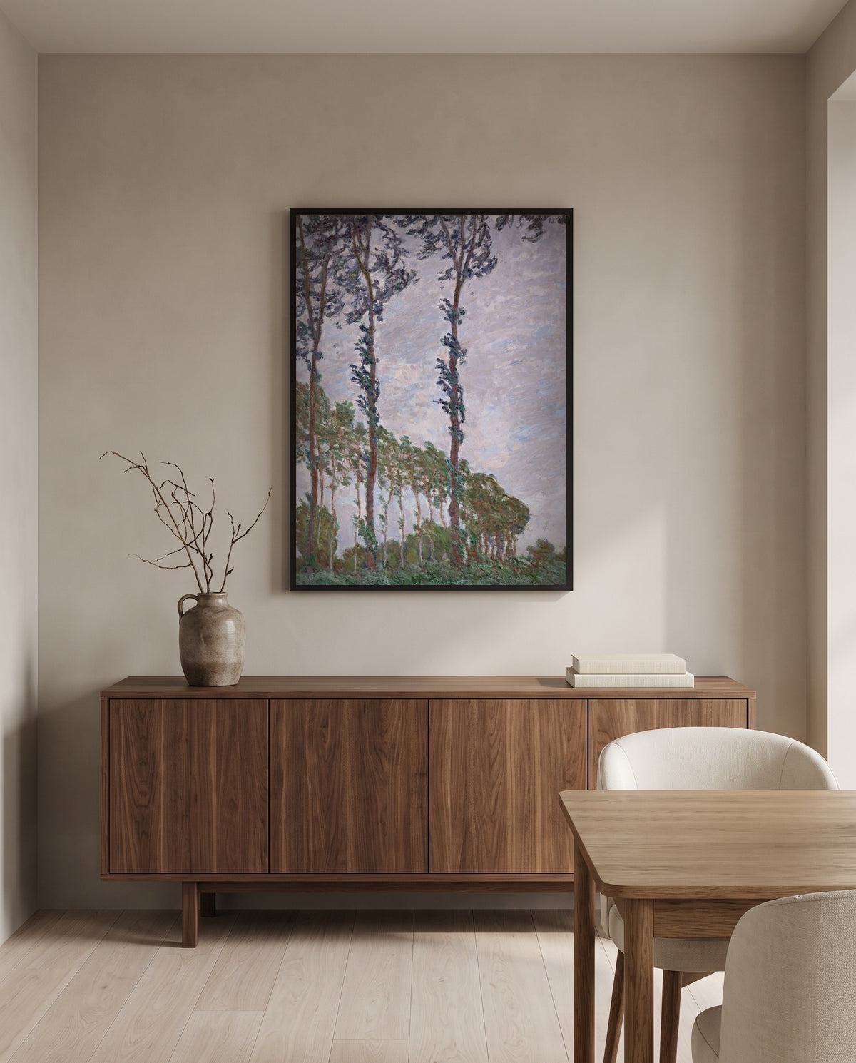 Wind Effect, Poplars by Claude Monet in a black frame above a walnut sideboard in a dining room