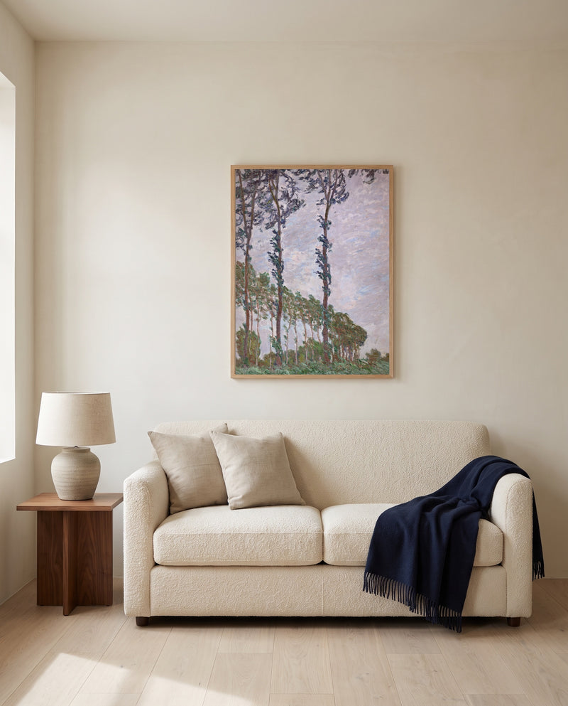 Wind Effect, Poplars by Claude Monet framed in natural oak above a cream sofa in a warm living room