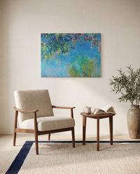 Wisteria by Claude Monet as a stretched canvas above a linen lounge chair in a reading corner