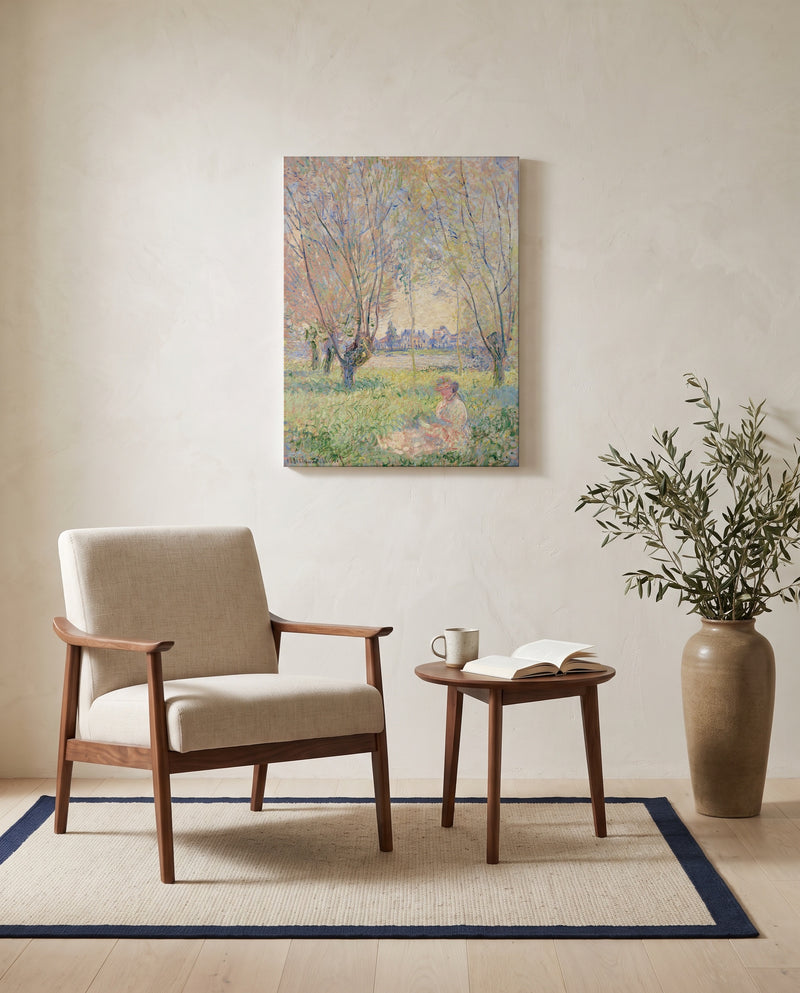 Woman under the Willows by Claude Monet as a stretched canvas above a linen lounge chair in a reading corner