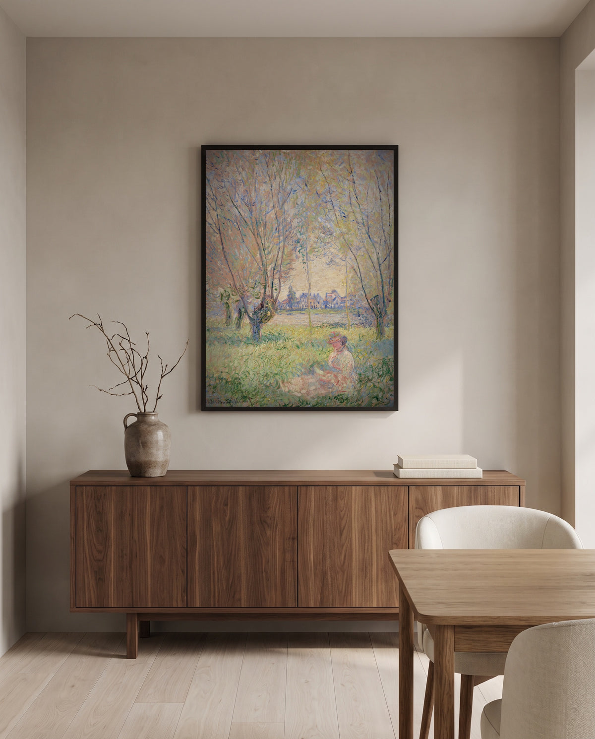 Woman under the Willows by Claude Monet in a black frame above a walnut sideboard in a dining room
