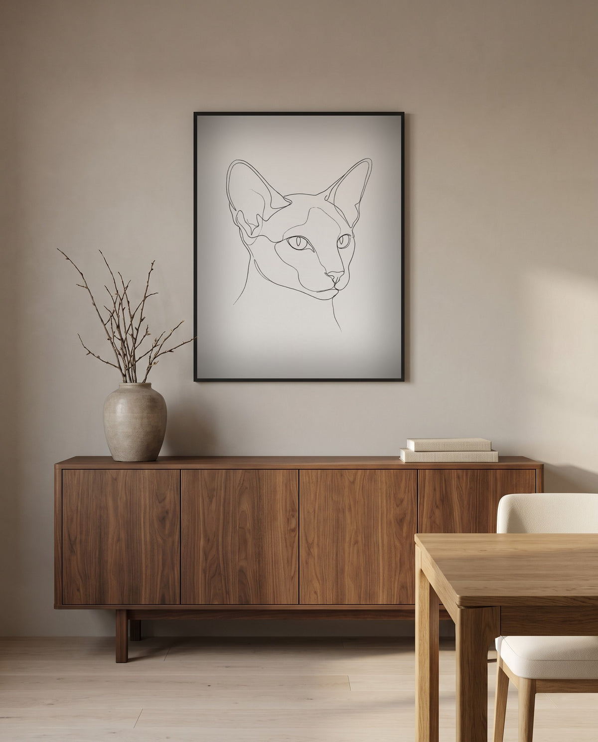 Custom line art cat portrait, in a black frame in a dining room
