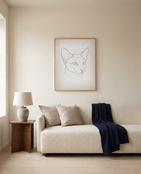 Custom line art cat portrait, framed above a sofa in a living room