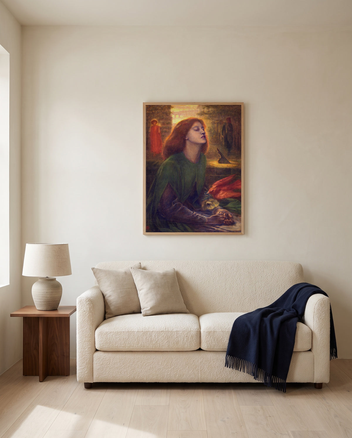 Beata Beatrix by Dante Gabriel Rossetti framed in natural oak above a cream sofa in a warm living room