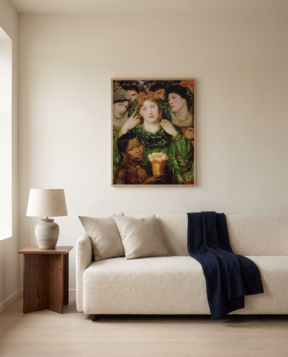The Beloved by Dante Gabriel Rossetti framed in natural oak above a cream sofa in a warm living room