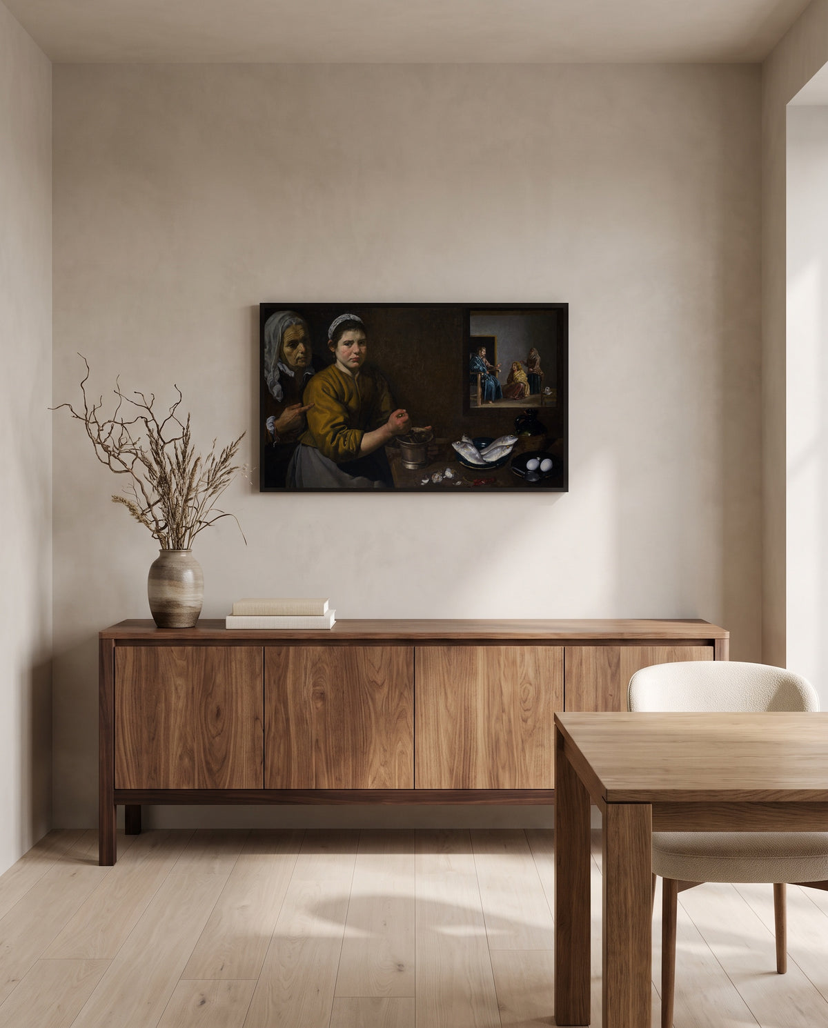 Martha and Mary by Diego Velázquez in a black frame above a walnut sideboard in a dining room