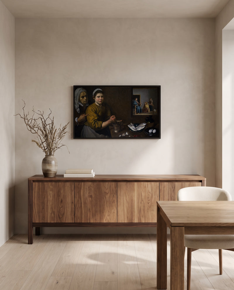 Martha and Mary by Diego Velázquez in a black frame above a walnut sideboard in a dining room