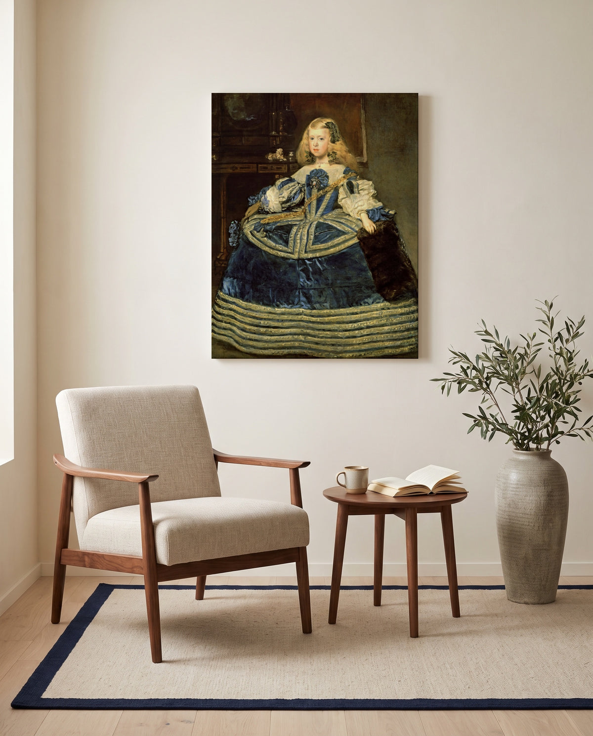 Infanta in a Blue Dress by Diego Velázquez as a stretched canvas above a linen lounge chair in a reading corner