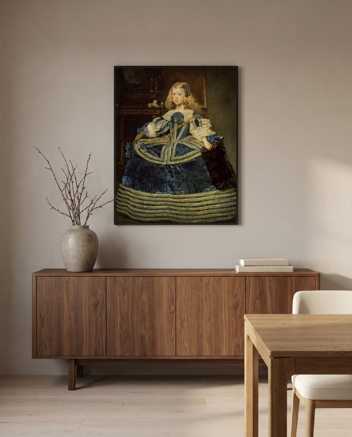 Infanta in a Blue Dress by Diego Velázquez in a black frame above a walnut sideboard in a dining room