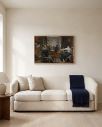 Las Hilanderas by Diego Velázquez framed in natural oak above a cream sofa in a warm living room