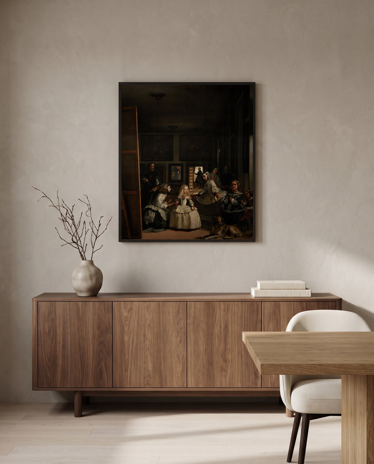 Las Meninas by Diego Velázquez in a black frame above a walnut sideboard in a dining room