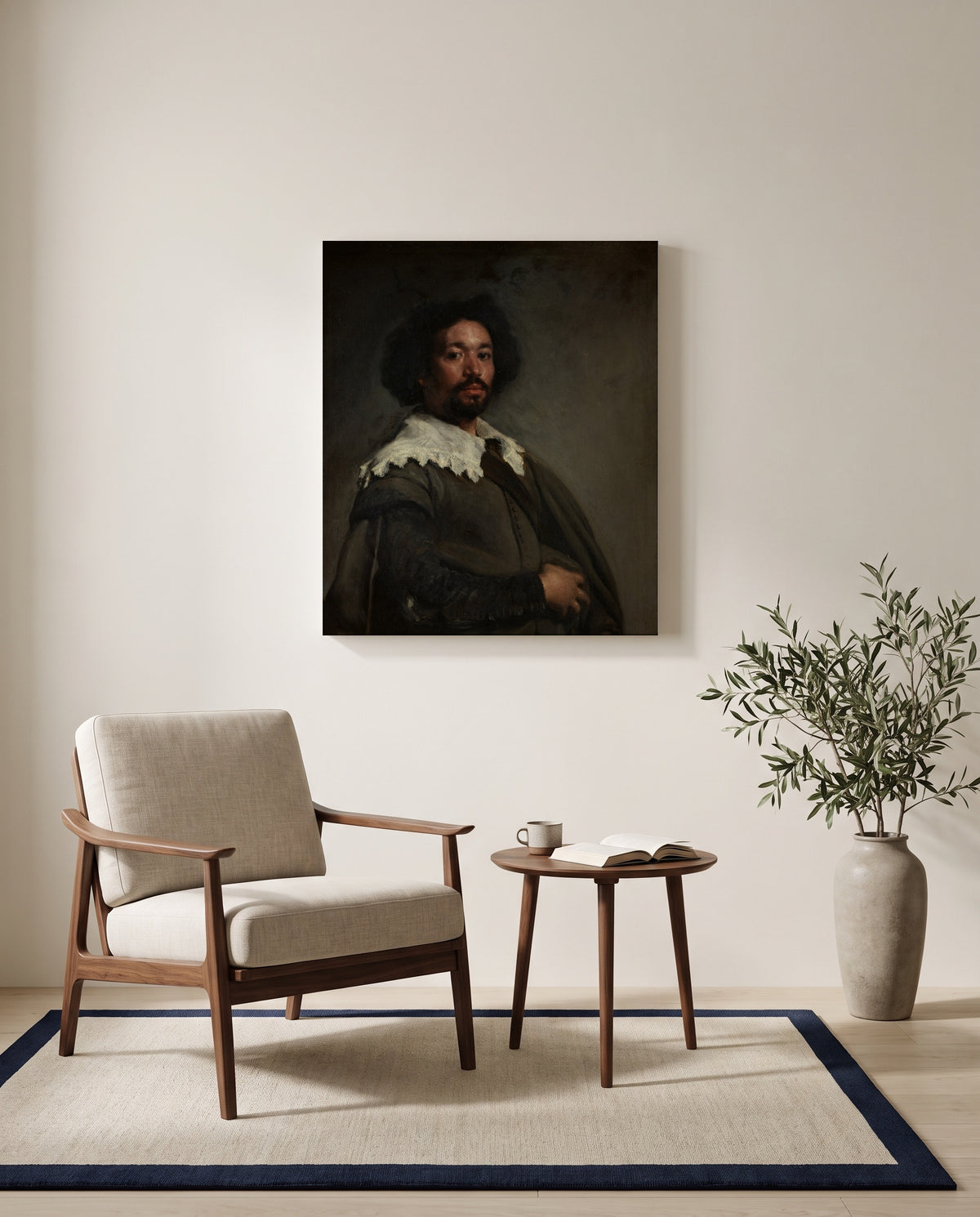 Juan de Pareja by Diego Velázquez as a stretched canvas above a linen lounge chair in a reading corner