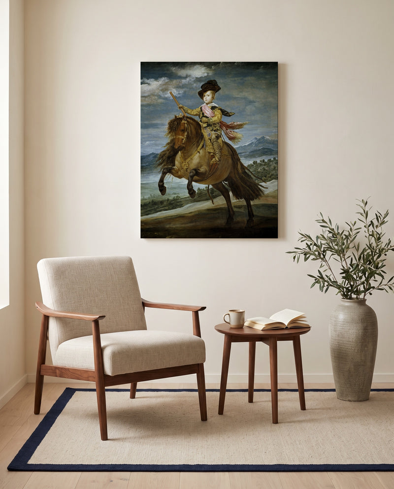 Prince Balthasar Charles by Diego Velázquez as a stretched canvas above a linen lounge chair in a reading corner