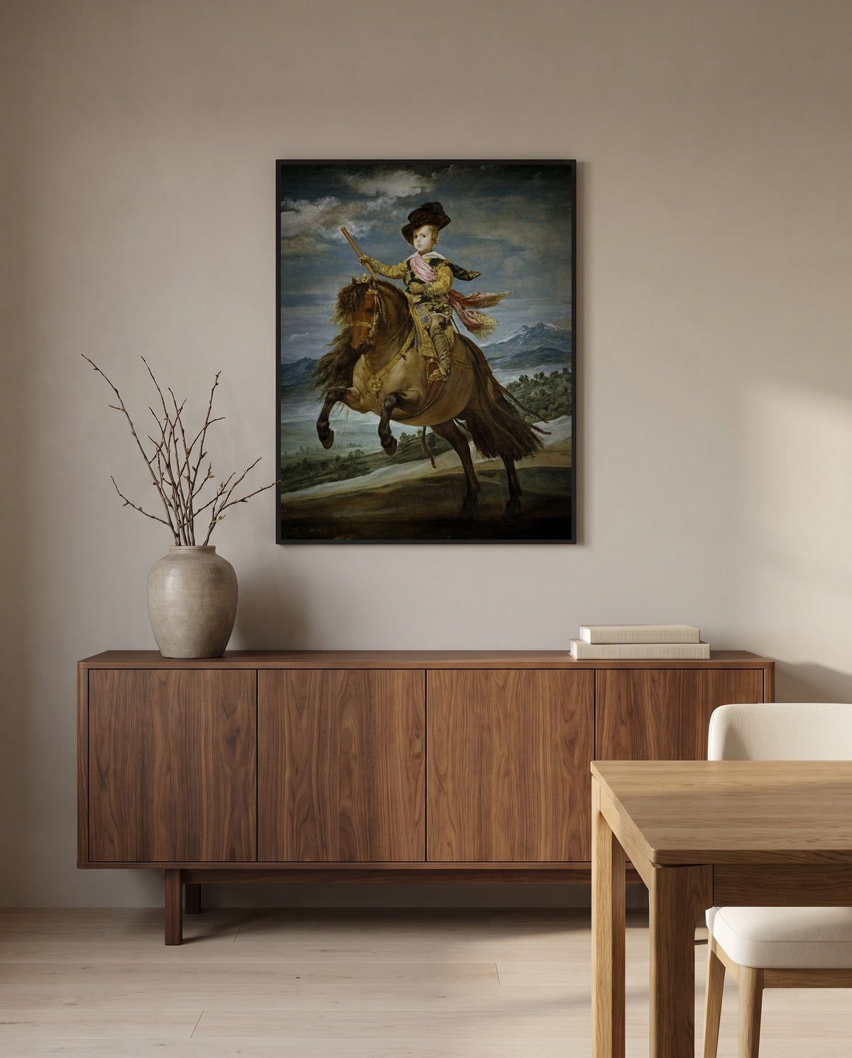 Prince Balthasar Charles by Diego Velázquez in a black frame above a walnut sideboard in a dining room