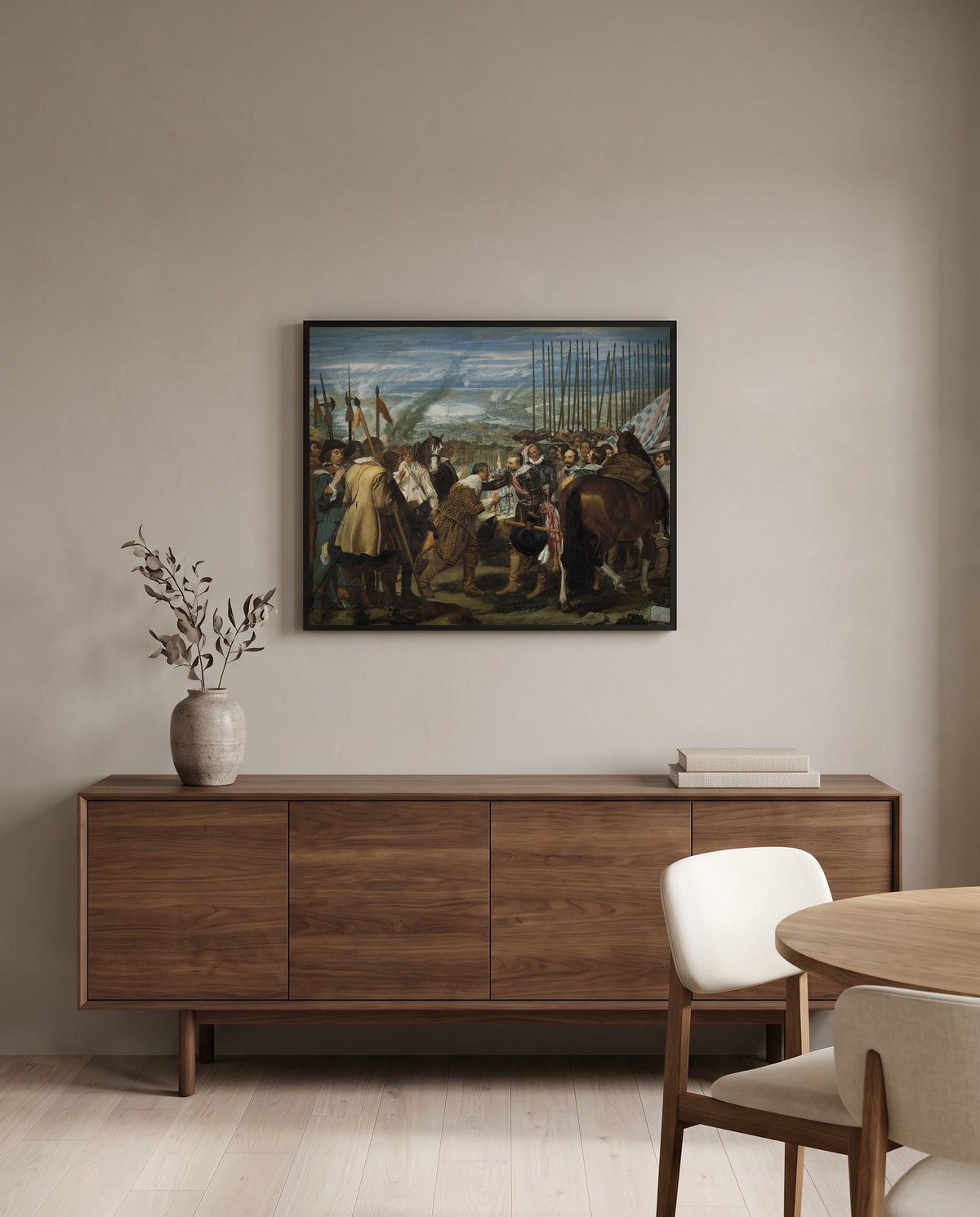 The Surrender of Breda by Diego Velázquez in a black frame above a walnut sideboard in a dining room