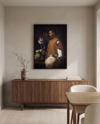 The Waterseller of Seville by Diego Velázquez in a black frame above a walnut sideboard in a dining room