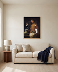 The Waterseller of Seville by Diego Velázquez framed in natural oak above a cream sofa in a warm living room